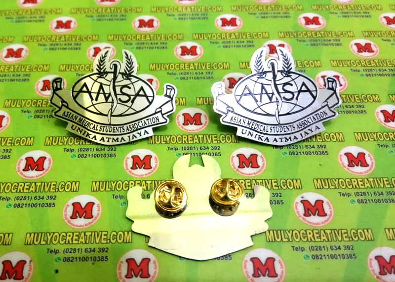 Pin Bros bentuk Logo AMSA Asian Medical Student Association - Lencana Pin Bros Unika Atma Jaya dari bahan Logam Stainless